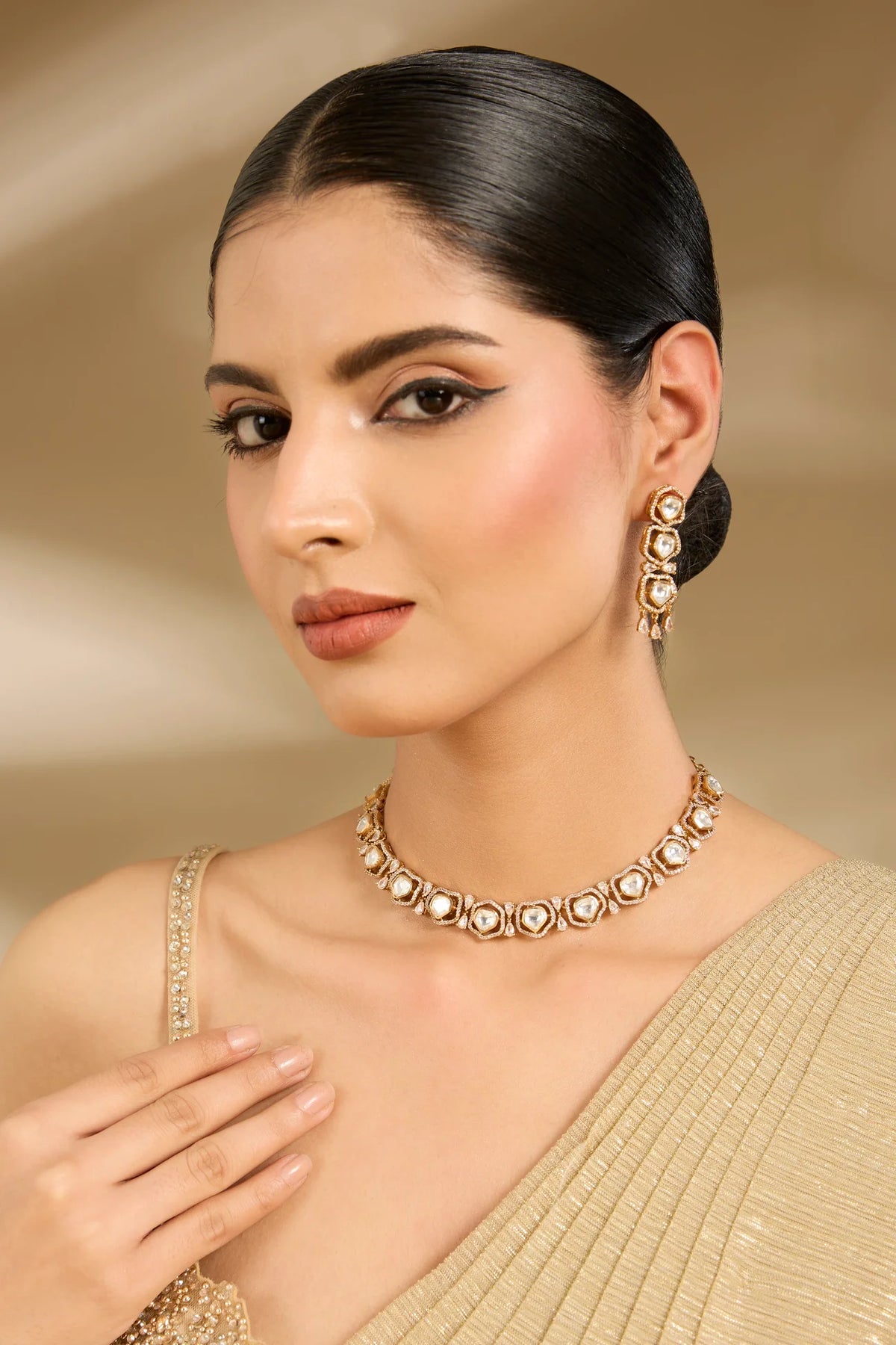 Gold-Plated Kundan Choker Necklace Set with Matching Earrings
Add a touch of traditional elegance to your occasi
