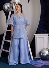 Load image into Gallery viewer, Contemporary cool yet effortlessly glam, the Cassie ensemble is going to be the trump card you need to elevate your style game!! The thigh skimming top, cut from diaphanous organza is adorned with tonal silk thread work, further uplifted with shimmering sequins and dreamy pearls. The eye-catching statement sleeves, make this an absolute must have! The organza shirt is layered over an impeccably tailored bustier and wide leg pants. The dip dyed medium silk dupatta, completes the ensemble with stunning flair.